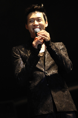 JYJ member Park Yuchun smiles during his concert in Barcelona, Spain on October 29, 2011. [C-JeS Entertainment]