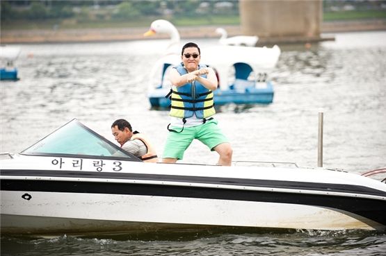 Korean singer PSY dances on a boat at Han River in Seoul, Korea during his music video shooting for "Gangnam Style" [YG Entertainment]