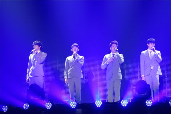 2AM members Jinwoon (left), Jo Kwon (second to left), Changmin (second to right), and Seulong (right) perform at their firm's joint concert “JYP NATION in Japan 2012” held at the Yoyogi National Stadium in Tokyo, Japan on August 18 and 19. [JYPE]

