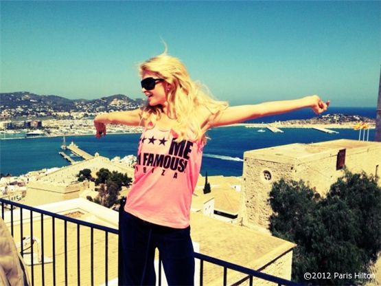 Paris Hilton poses by stretching her arms wide in a photo posted onto her official website on August 14, 2012. [Paris Hilton official website]