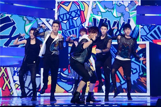 VIXX members HongBin (left), Ken (second to left), N (center), Ravi (second to right) and Leo (right) pump their fists in the air while performing on Mnet's "M! CountDown." [Mnet]
