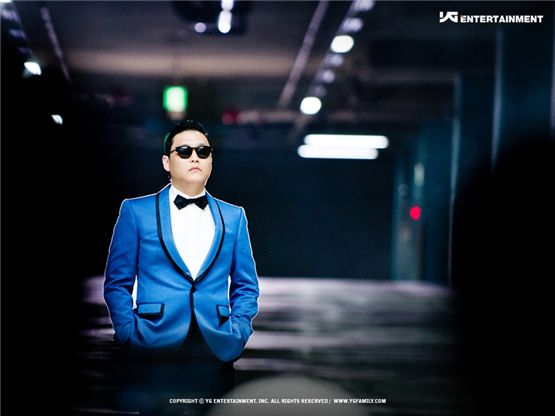 K-pop artist PSY poses in a blue-colored suit in a still-shot from his music video for "Gangnam Style," dropped on July 15, 2012. [YG Entertainment]