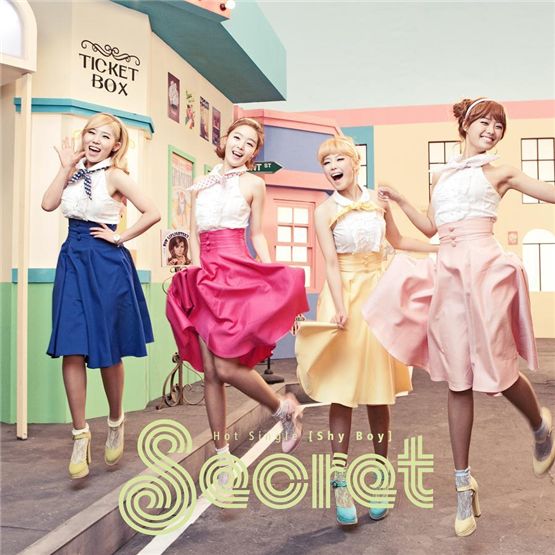 Secret members Zinger (left), Han Sun-hwa (second to left), Jun Hyo-seong (second to right) and Song Ji-eun (right) donned in colorful skirts jump from the ground in the cover photo of the single album "Shy Boy," dropped on January 6, 2012. [TS Entertainment]