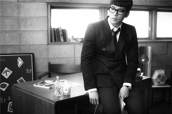 2AM's lead vocalist Changmin sits on a desk during his photo shooting for the group's latest domestic album, "F.Scott Fitzgerald`s Way Of Love," dropped on March 12, 2012. [JYP Entertainment]