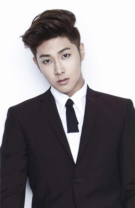 TVXQ! member U-Know Yunho poses in a simple wine-colored suit in a photo released for the duo's sixth album "Catch Me," dropped on September 24, 2012. [SM Entertainment]
