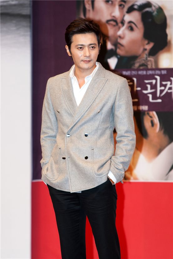 Jang Dong-gun matches a grey jacket a simple white shirt at the Gala Presentation of "Dangerous Liaisons," one of the Day-2 programs of the 17th Busan International Film Festival, at Shinsege Centum’s Culture Hall in Busan, South Korea, on October 5, 2012. [Lee Jin-hyuk/10Asia]