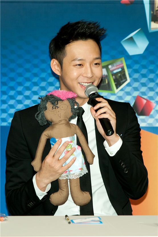 JYJ member Park Yuchun shows his AWOO doll, a part of the UNICEF's campaign to donate its profit to underprivileged children, during the appointment ceremony of Korea Brand & Entertainment Expo [KBEE2012], held at Korea Trade-Investment Promotion Agency's head office in southern Seoul, Korea on October 17, 2012. [Lee Jin-hyuk/10Asia]