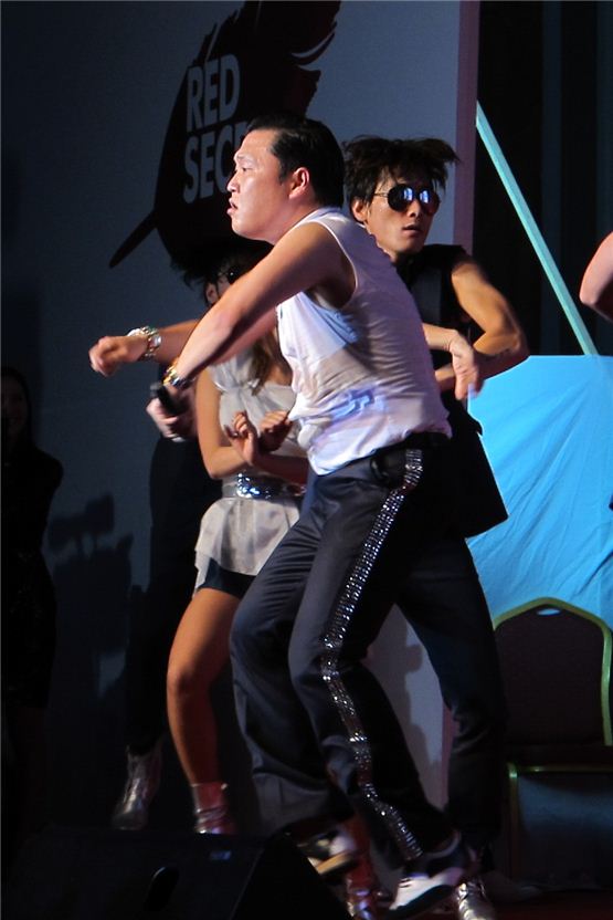 PSY shows his original horse riding dance to "Gangnam Style" during the "2012 LOTTE NIGHT PARTY" held at Busan's Lotte Hotel in South Korea on October 6, 2012. [Lee Hye-ji/10Asia]