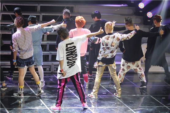Block B members show their backs on the stage during an hour-long showcase celebrating the release of their first full-length album "BLOCKBUSTER," held at AX-KOREA in Seoul, Korea on October 18, 2012. [Stardom Entertainment]