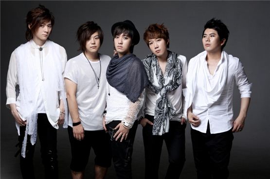 Korean rock band Nemesis memebers Ha Sebin (left), Jung Euyseok (second to left), Noh Seungho (center), Choi Sungwoo (second to right) and Jeon Kwiseung (right) pose together in white shirts for the cover photo of their third studio album "THE PIANO," dropped on August 23, 2011. [Poem Entertainment]