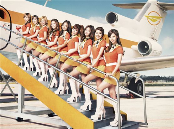 GIrls' Generation members Sunny (left), Taeyeon (second to left), Hyoyeon (third to left), Jessica (fourth to left), Yoori (center), Tiffany (fourth to right), Yoona (third to right), Sooyoung (second to right) and Seohyun (right) pose together in a teaser image of their second full-length Japanese album "GIRLS GENERATION II~Girls & PEACE~," set to hit stores on November 28, 2012. [Girls' Generation official Japanese website]