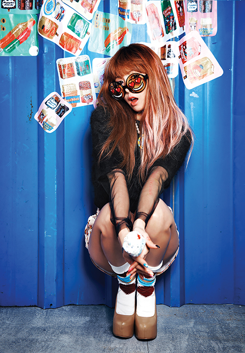 4minute's Hyuna poses on blue background in a photo taken for her second solo mini-album "MELTING," released on October 21, 2012. [Cube Entertainment]