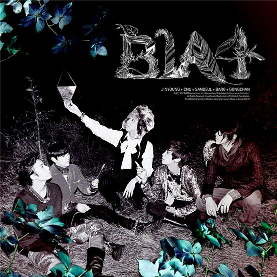 B1A4 members Gongchan (left), Sandeul (second to left), Baro (center), Jinyoung (second to right) and CNU (right) pose together in the cover picture of their third mini-album "IN THE WIND," which became available online on November 12, 2012. [WM Entertainment]