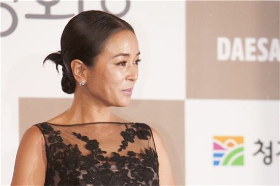 Venice-winning pic "Pieta" actress Cho Min-soo greets in front of the photo wall at the 33th Blue Dragon Film Awards ceremony held at the Sejong Center in Seoul, South Korea on November 30, 2012. [10Asia/ Brandon Chae]