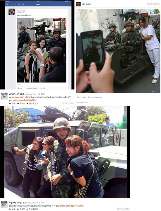 쿠데타가 발생한 태국에서 시민들이 군인과 함께 셀카를 찍는 기현상이 일어나고 있다.