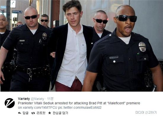 ▲비탈리 세디우크가 브래드 피트를 폭행한 혐으로 체포되고 있다. (사진: 미국 연예 매체 '버라이어티' 트위터 캡처)