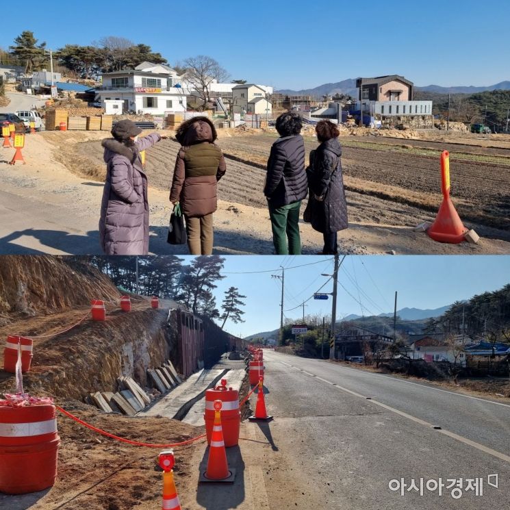 양산시는 교통체증에 대비해 지산마을까지 왕복 2차로 도로 정비 공사와 함께 인도를 설치 중이다. /주철인 기자 lx906@