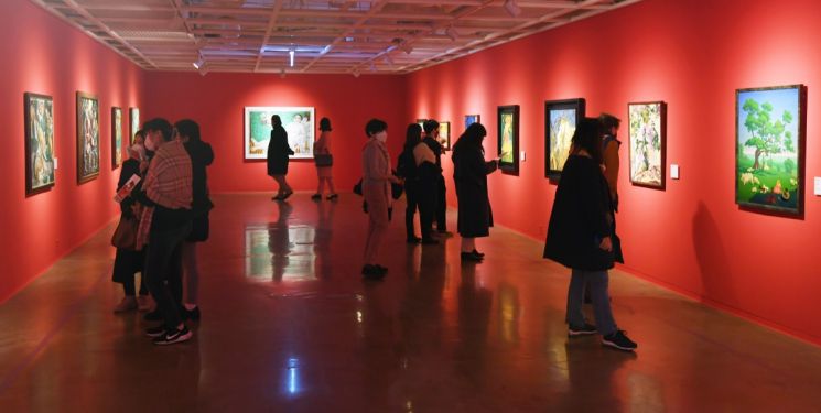 Visitors viewing the exhibition 'Kandinsky, Malevich & Russian Avant-Garde'.