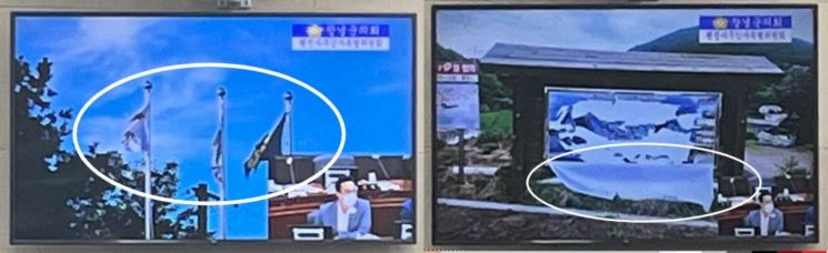 경남 창녕군 한 마을회관에 게양순서도 틀리게 걸려 있는 태극기(왼쪽)와 찢어진채 방치된 마을 안내도.