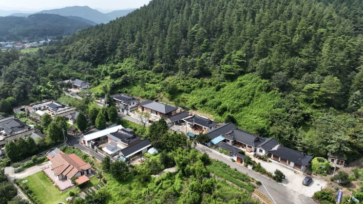 A panoramic view of Jangjaeri village in Jangan-myeon, Boeun, Chungbuk, where the 'Landslide Disaster Preparedness Evacuation Drill' was conducted on the 22nd. The forest behind the village residential area is currently designated as a landslide-prone zone, and the forestry authorities assess that the risk of actual landslides is high during heavy rainfall. Provided by the Korea Forest Service