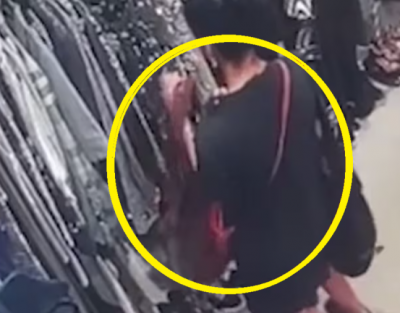 옷을 훔쳐 가방에 넣는 골리즈 가라만의 모습이 담긴 CCTV 영상 [사진출처=뉴질랜드 헤럴드 유튜브 갈무리]