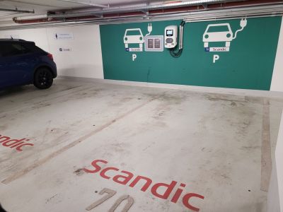 Electric vehicle chargers installed in the underground parking lot of a large building in Hamburg, Germany. Despite it being a weekday daytime, the electric vehicle parking spaces are completely empty. Photo by Woo Su-yeon
