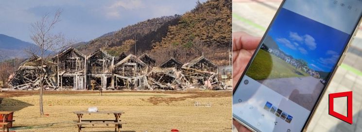 의성군과 농림축산식품부가 농촌 활성화 정책의 일환으로 조성한 ‘고운마을’이 산불로 대부분 타버렸다. 한 주민이 산불이 발생하기 전 마을 사진을 보여주고 있다. 변선진 기자