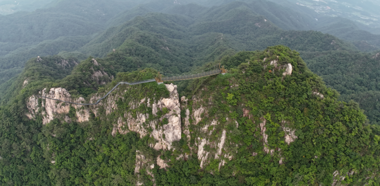 "Bridge to Be Built Over Unaksan Scenery"... Pocheon City Accelerates Suspension Bridge Installation at Summit