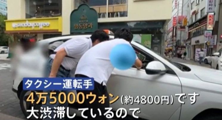 한국 택시기자가 명동에서 홍대까지 가려는 일본인에게 4만5000원을 내라고 하고 있다. 일본 TBS방송 캡처