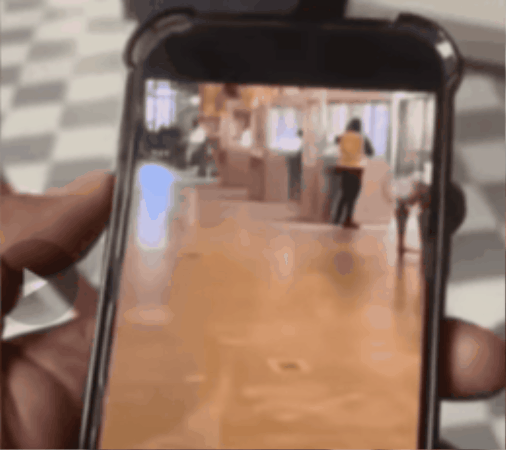 The Apollo Gallery (left), admired by tourists, is shown in a video obtained and released by the French broadcaster BFMTV, capturing a man wearing fluorescent work clothes touching the security glass in the Louvre Apollo exhibition room while working. At first glance, it appears to be a routine artifact inspection by museum staff, but this was a planned criminal act. /AFP Yonhap News Agency, Youtube 'BFMTV' Photo by AFP