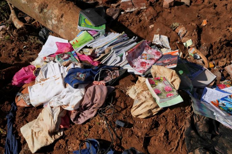 Books and other belongings are placed in a house damaged by a landslide caused by heavy rains from Cyclone Ditwah in Kandy, Sri Lanka. Photo by Reuters Yonhap News