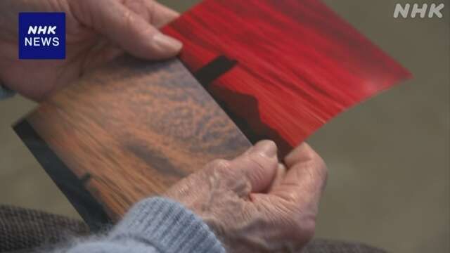 사키에씨가 딸을 위해 가지고 다니는 직접 찍은 노을 사진. NHK.