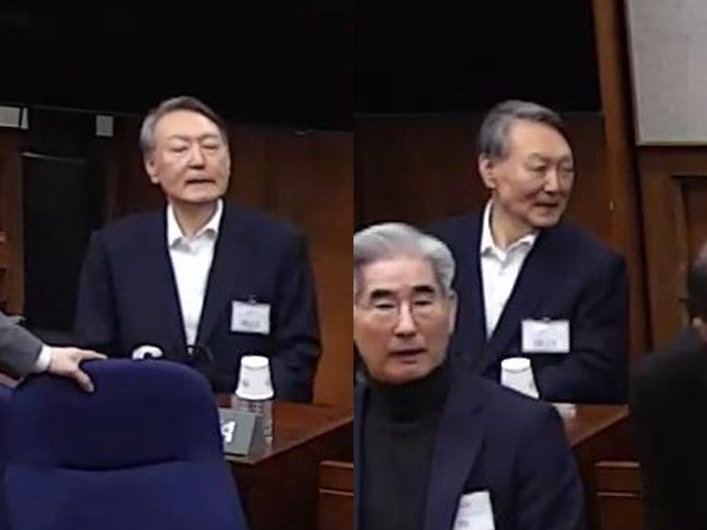 무기징역 선고받은 尹, 굳은 표정으로 허공 응시…지지자들 응원엔 '미소'