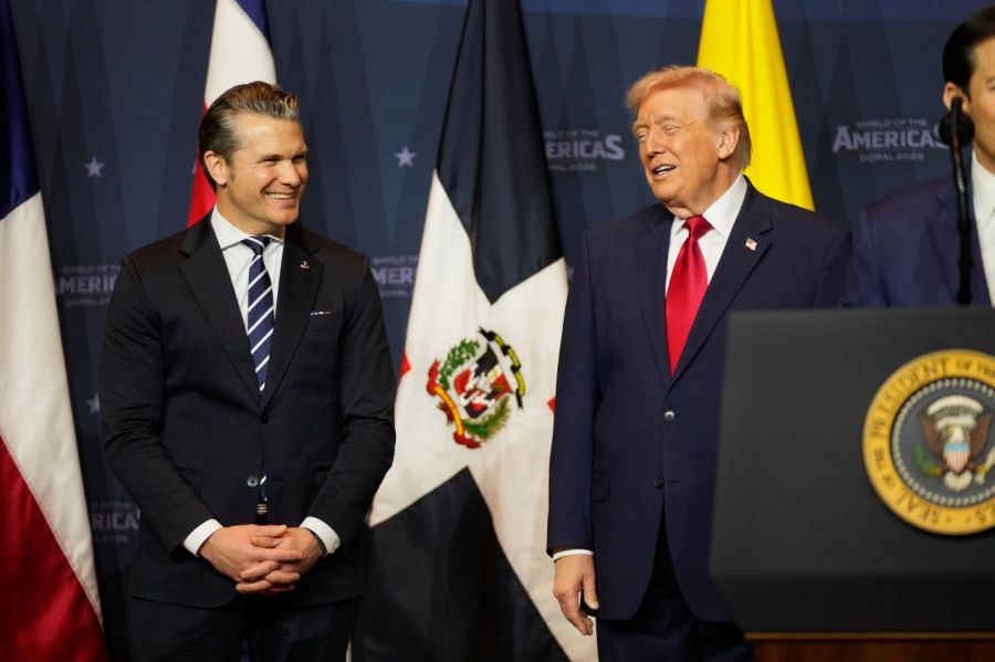 Pete Hegseth, US Secretary of Defense (left), is seen smiling with US President Donald Trump at the Shield of America Summit held in Miami, USA, on the 7th (local time). AP Yonhap News