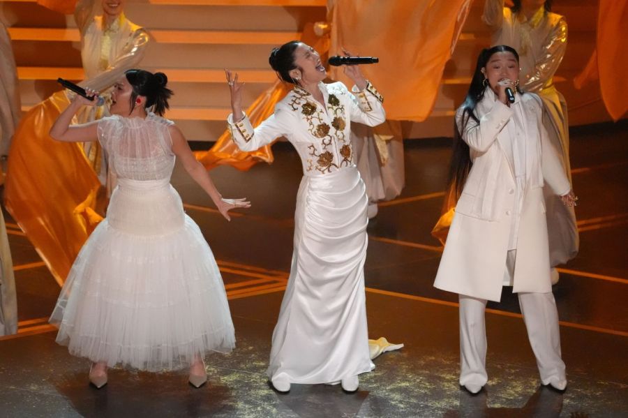 Lee Jae (center), Audrey Noona (right), and Ray Ami (left), the voices behind the girl group HUNTR/X in the movie, performed on the stage during the second part of the awards ceremony celebration. Photo by AP Yonhap News