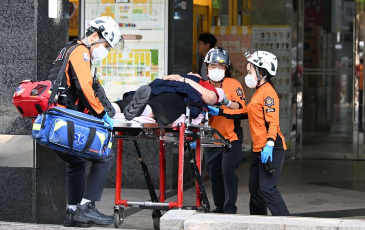 Injured people are taken to hospital after a stabbing at a large commercial complex housing Homeplus' Incheon Guwol branch on the 13th. Yonhap News.