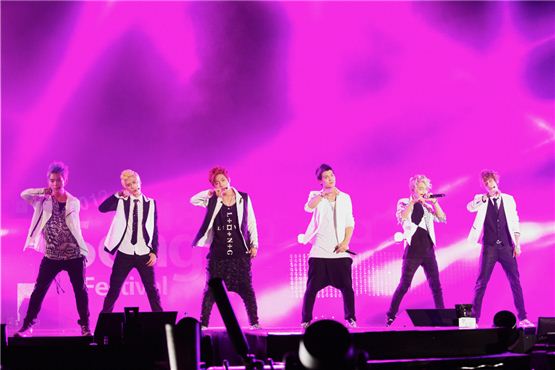 Teen Top members Ricky (left), Chunji (second to left), Changjo (third to left), C.A.P (third to right)  L.Joe (second to right), and Niel (right) perform with purple spotlights at the 2012 Asia Song Festival held during The Expo 2012 Yeosu Korea in Jeolla Province on August 4, 2012. [KOFICE]