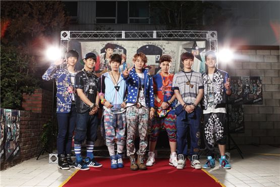 Boy band BTOB poses in front of the photo wall at their "Photo Day" event held at the Cube Cafe in Seoul in South Korea on September 24, 2012. [Cube Entertainment]