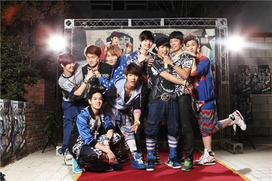 Boy band BTOB poses in front of the photo wall at their "Photo Day" event held at the Cube Cafe in Seoul in South Korea on September 24, 2012. [Cube Entertainment]