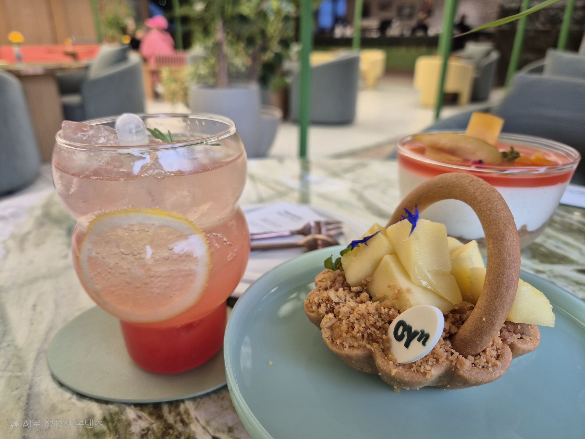 Seasonal desserts include 'Peach Plum Tiramisu' and 'Mango Basket Tart,' along with a collagen drink. The tiramisu harmoniously blends the flavors of cream cheese, plum, and peach. The drink is also available for purchase at the first-floor cafe. Photo by Minji Lee.