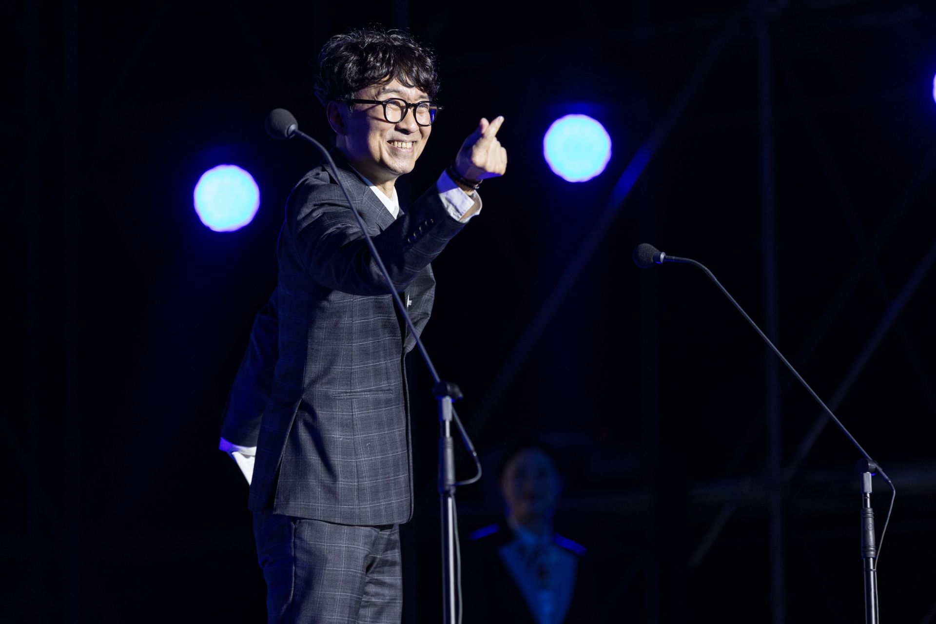 Jang Hangjun, Executive Chairman of the Jecheon International Music & Film Festival, is making a finger heart at the opening ceremony held at Jecheon Airfield in Chungbuk last September. Courtesy of Jecheon International Music & Film Festival